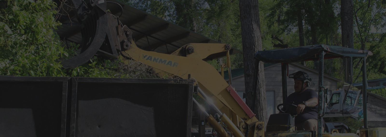 loading tree brush into a truck
